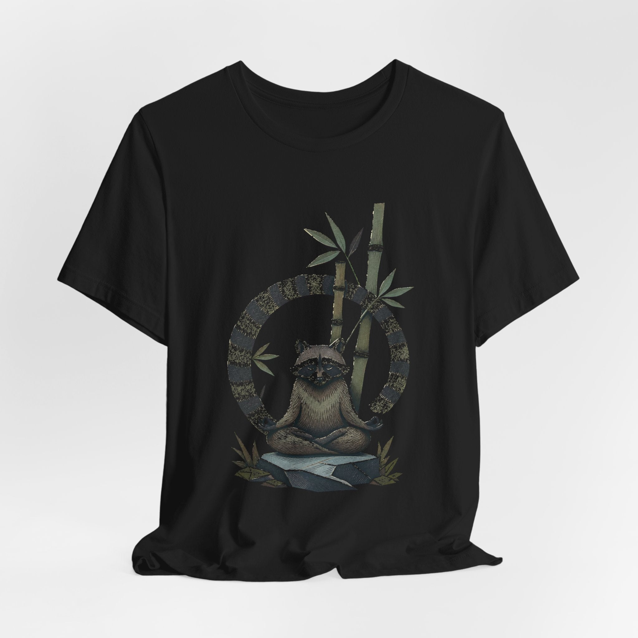 Meditating raccoon design shown on a black unisex tee, Wrong Habitat