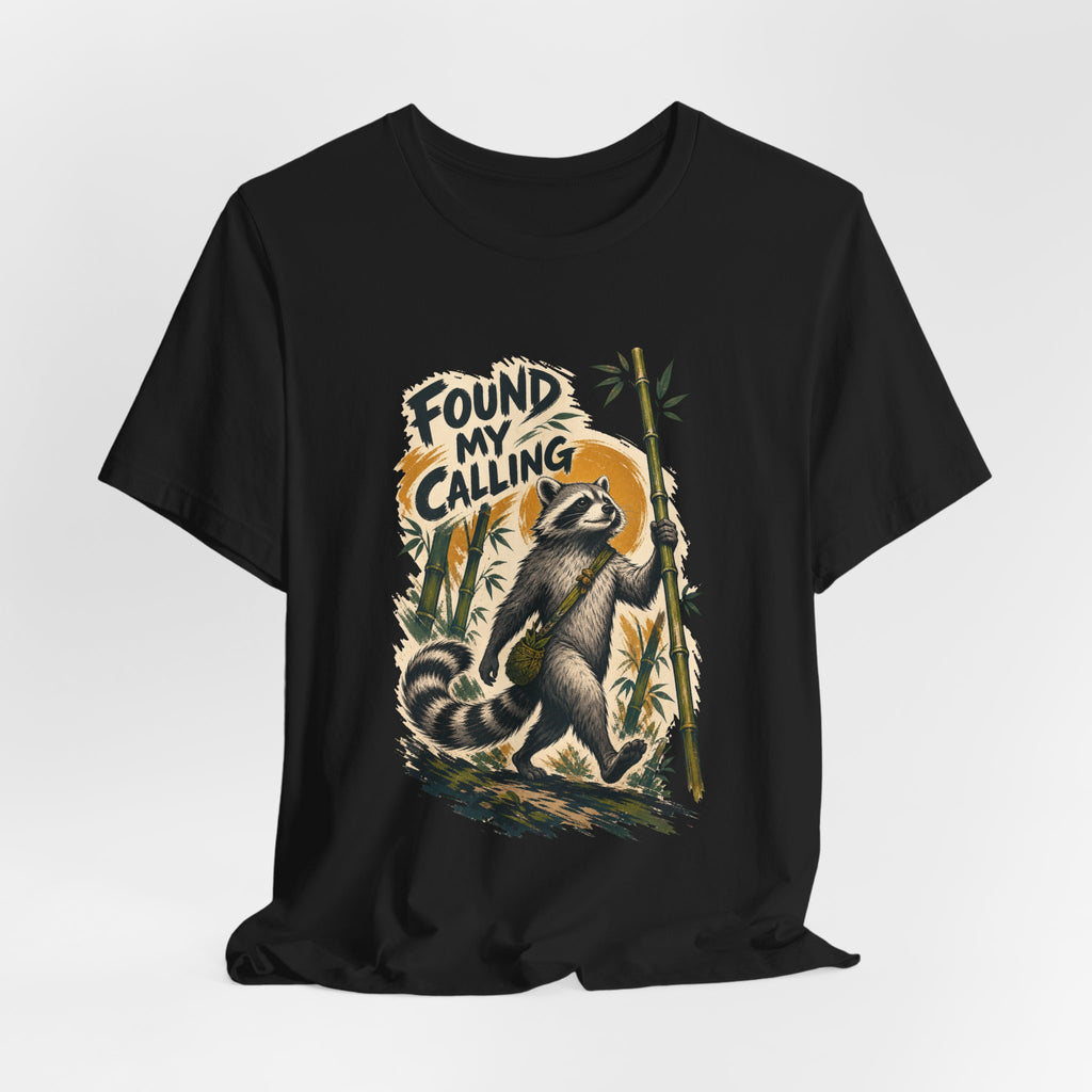 Zen raccoon monk design shown on a black unisex tee, Wrong Habitat